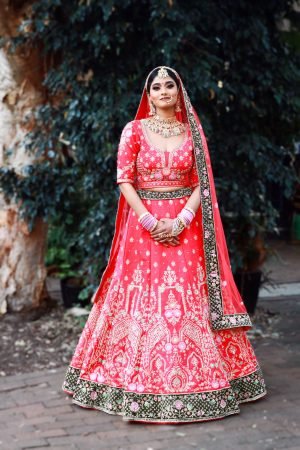 Exquisite Red Bridal Lehenga with Intricate Gold & Green Embroidery