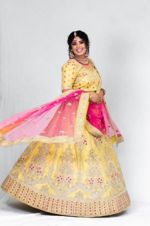 Radiant Yellow Bridal Lehenga with Intricate Embroidery & Pink Dupatta